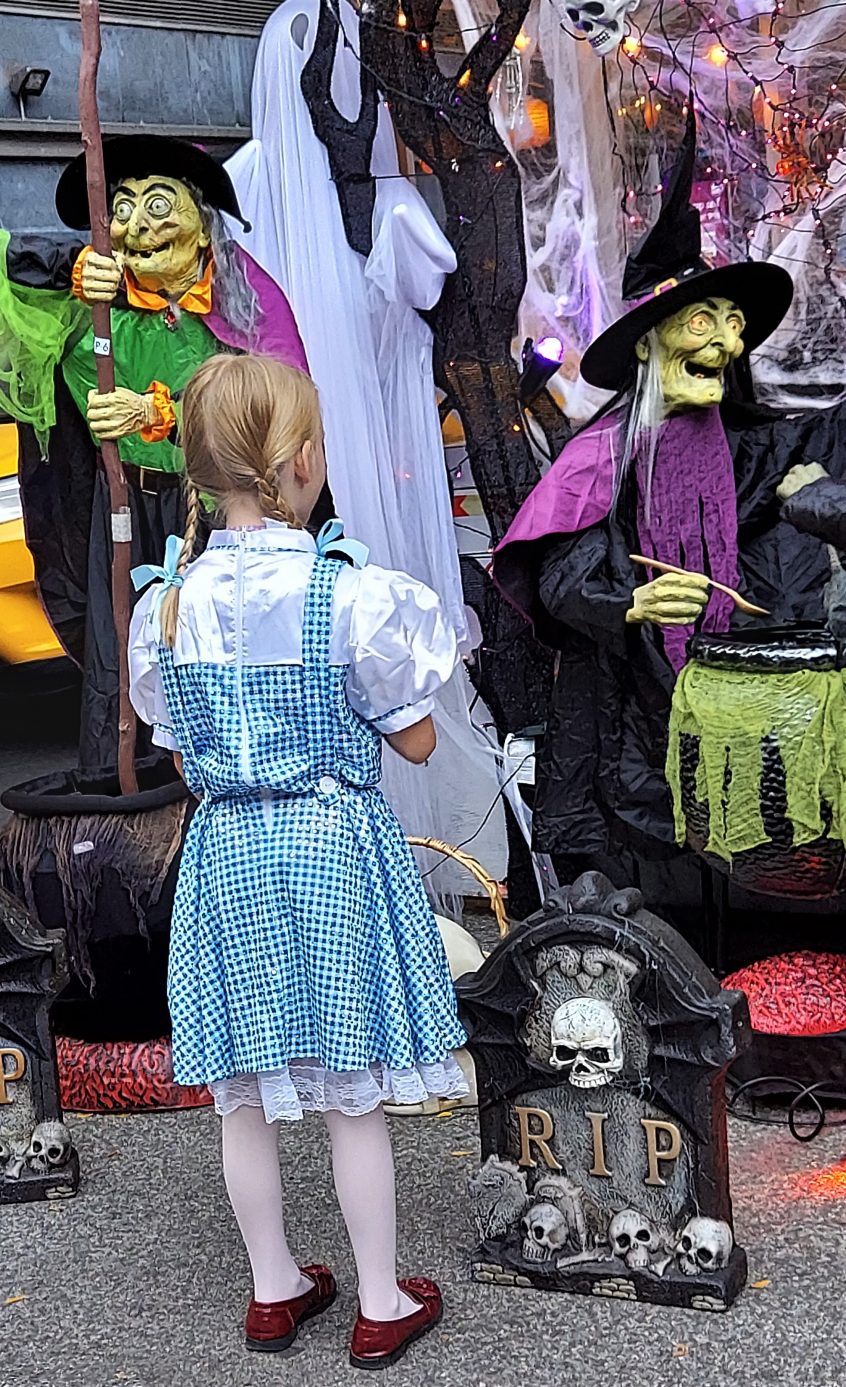 Dressed as Dorothy speaking with witches