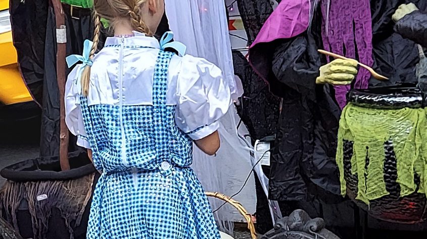 Dressed as Dorothy speaking with witches
